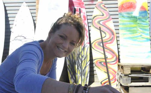 Jenni Mann is one of the artists sharing her skills painting surfboards that will decorate Yamba’s CBD for the upcoming Comedy, Music and Arts festival. Jenni Mann is one of the artists sharing her skills painting surfboards that will decorate Yamba’s CBD for the upcoming Comedy, Music and Arts festival.